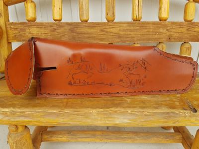 Rifle Scabbards Assorted And Some With Mounting Straps To Attach to What Ever You Ride. Horse Or Horse Powered Vehicle With Wheels. Custom, Full Grain Leather, Hand tooled, Hand made in the Okanagan, Oliver, B.C., Canada.